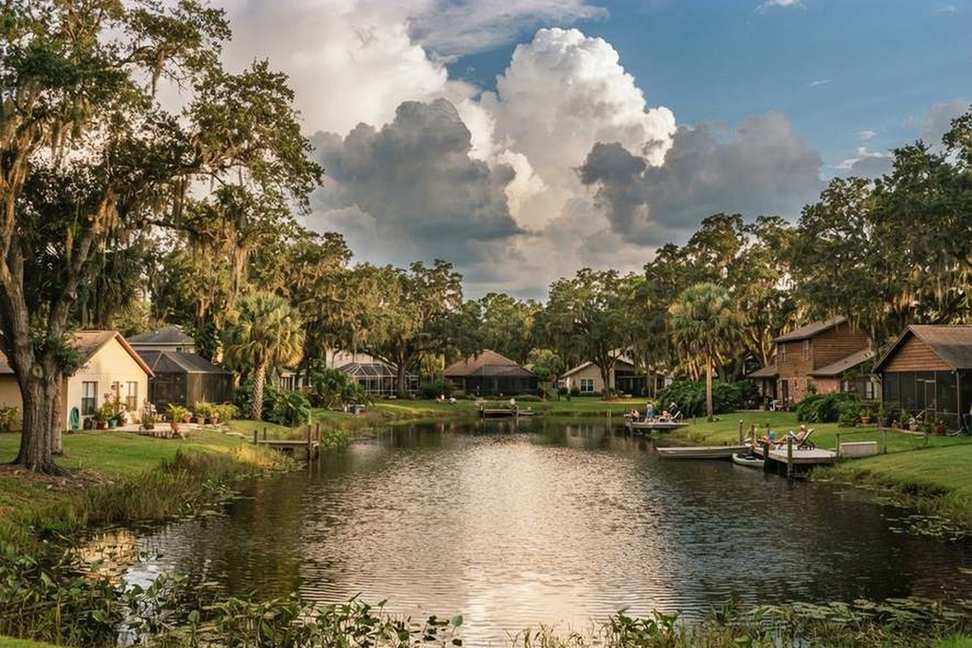 Residential lake with afternoon storm clouds building in the Orlando area